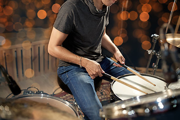 Image showing musician or drummer playing drum kit at concert