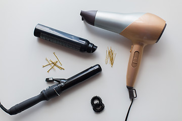 Image showing hairdryer, styler or curling iron and hair spray