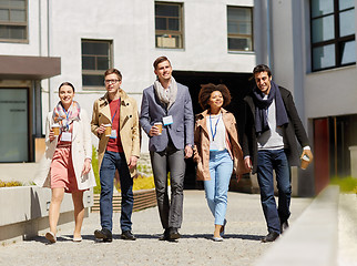 Image showing office workers with coffee on city street