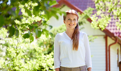 Image showing happy smiling woman at summer garden