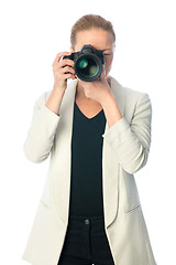 Image showing Beautiful young photographer with camera in professional studio