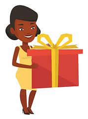 Image showing Joyful african woman holding box with gift.