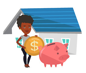 Image showing Woman puts money into piggy bank for buying house.