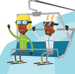 Image showing Two happy skiers using cableway at ski resort.