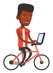 Image showing Man riding bicycle and working on a laptop.