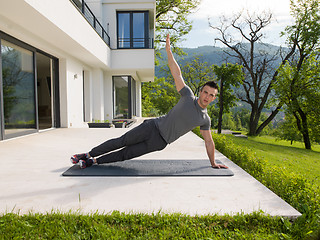 Image showing man doing morning yoga exercises