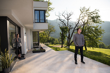 Image showing man in front of his luxury home villa