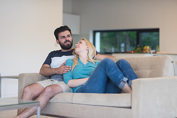 Image showing young happy couple relaxes in the living room