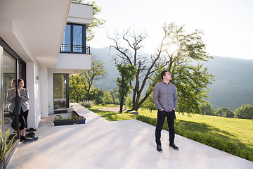 Image showing man in front of his luxury home villa