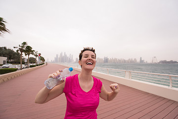 Image showing young woman celebrating a successful training run