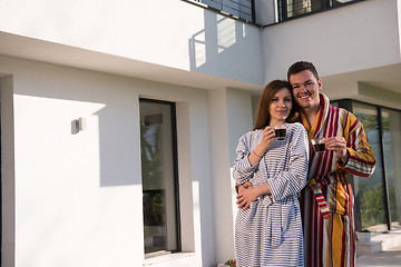 Image showing Young beautiful couple in bathrobes