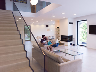 Image showing young happy couple relaxes in the living room