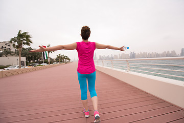 Image showing young woman celebrating a successful training run