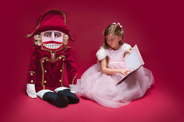 Image showing The beauty ballerina sitting with nutcracker