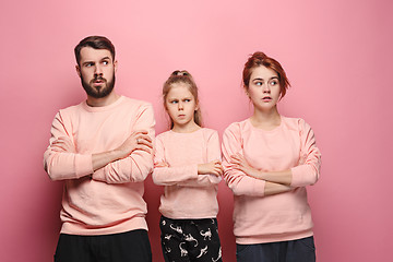 Image showing The sad family on pink