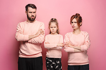 Image showing The sad family on pink