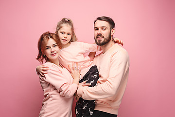 Image showing Happy young family with one little daughter posing together