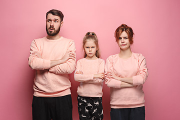 Image showing The sad family on pink
