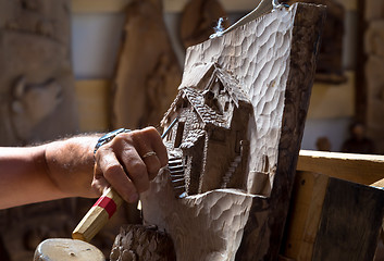 Image showing Sculptor hands working wood