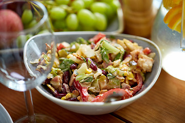 Image showing smoked chicken salad in bowl on wooden table