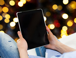 Image showing close up of male hands holding tablet pc