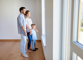 Image showing happy family with child at new home or apartment