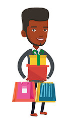 Image showing Happy man holding shopping bags and gift boxes.