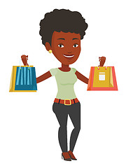 Image showing Happy woman holding shopping bags.