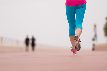 Image showing woman busy running on the promenade