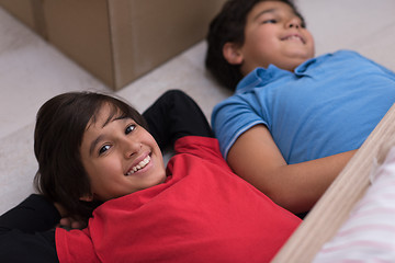 Image showing young boys having fun on the floor