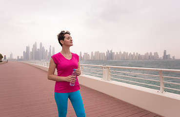 Image showing young woman celebrating a successful training run