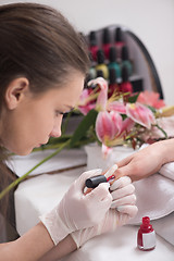 Image showing Woman hands receiving a manicure