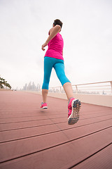 Image showing woman running on the promenade