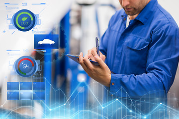 Image showing auto mechanic with clipboard at car repair shop