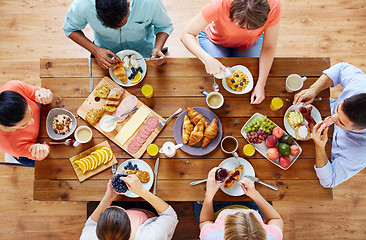 Image showing group of people having breakfast at table