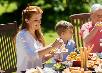 Image showing happy family having dinner or summer garden party