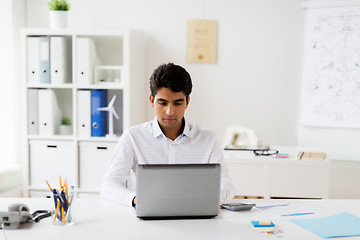 Image showing businessman with laptop working at office