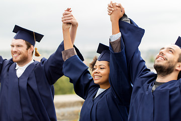 Image showing happy students celebrating graduation