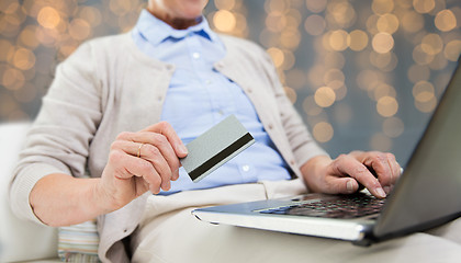 Image showing senior woman with laptop and credit card