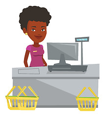 Image showing Cashier standing at the checkout in supermarket.