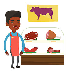 Image showing Butcher offering fresh meat in butchershop.