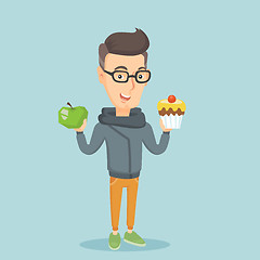 Image showing Man choosing between apple and cupcake.