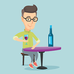 Image showing Man drinking wine at restaurant.
