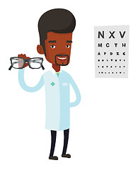 Image showing Professional ophthalmologist holding eyeglasses.