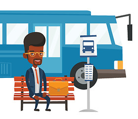 Image showing Business man waiting at the bus stop.