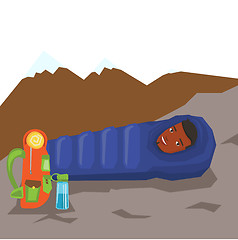 Image showing Man resting in sleeping bag in the mountains.