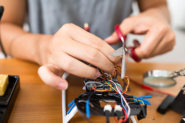 Image showing Cutting wire on drone board