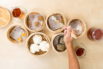 Image showing Top view of eating dim sum