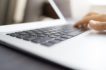 Image showing Human hands working on laptop