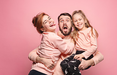 Image showing Happy young family with one little daughter posing together